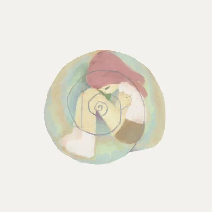 girl curled up inside of a sea shell 