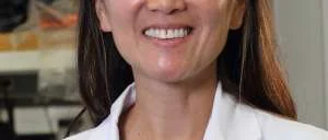  woman in white lab coat
