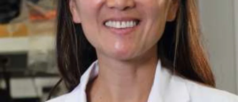 woman in white lab coat