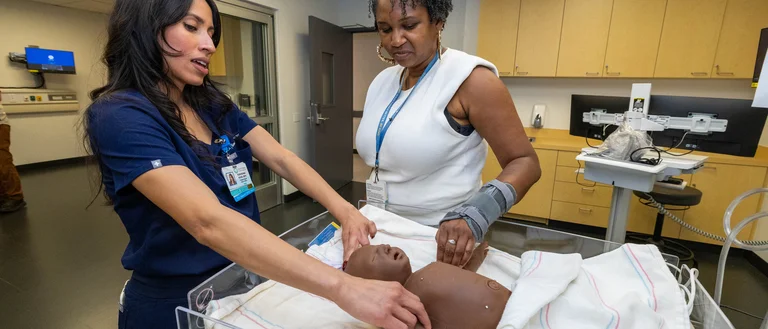 Two professionals at the simulation center opening event