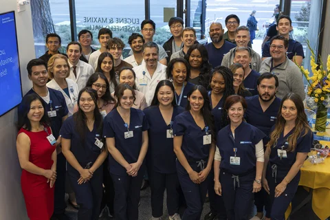 A group photo of physicians, doctors, trainees, and staff associated with the simulation center 