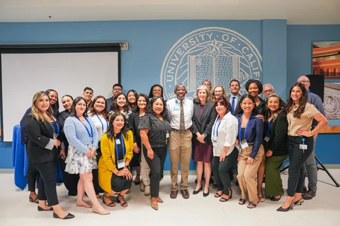 Dr. Abel and Dr. Currier with DOM admin staff at Research Day 2024 
