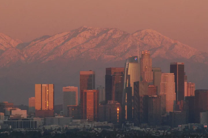 LA at sunset with snowy mountains