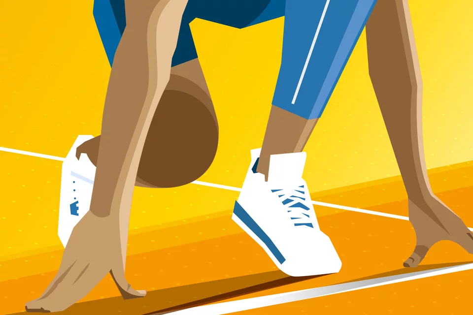 A person's wearing tennis shoes about to begin a race
