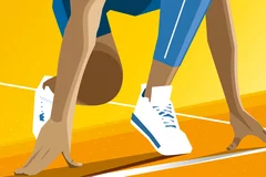 A person's wearing tennis shoes about to begin a race