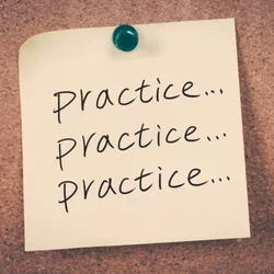 Yellow sticky note with word practice followed by ellipsis written three times. The sticky note is tacked onto a corkboard background with a green pin..