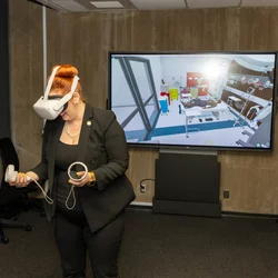 Woman trying virtual reality technology to assist in knee replacement surgery 