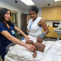 Two professionals at the simulation center opening event