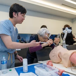 A student and instructor is practicing an intubation procedure at the simulation center.