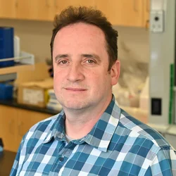 Vyacheslav Palchevskiy headshot in the lab
