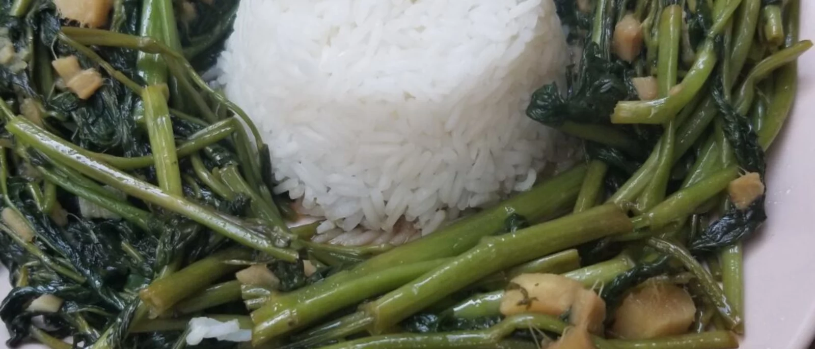 Ong Choy, a sauteed green vegetable served around a mound of white rice