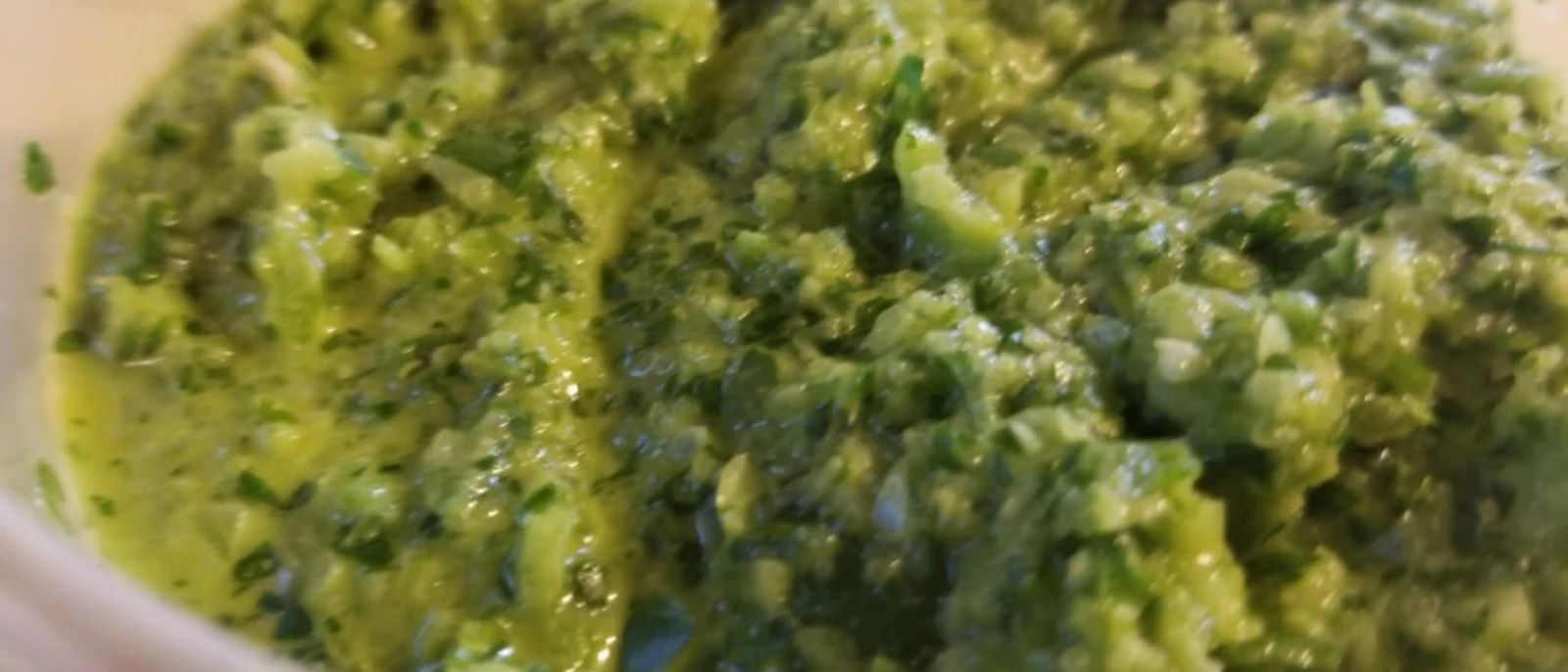 Sofrito is a green salsa made with chilis, olives, garlic, onion, and herbs