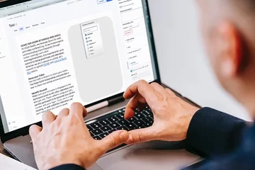 Man on computer typing