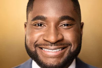Photo is face of Dr. Utibe Essien, who is a black man with a beard.