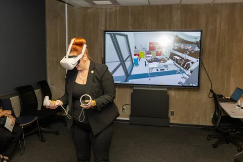 Woman trying virtual reality technology to assist in knee replacement surgery
